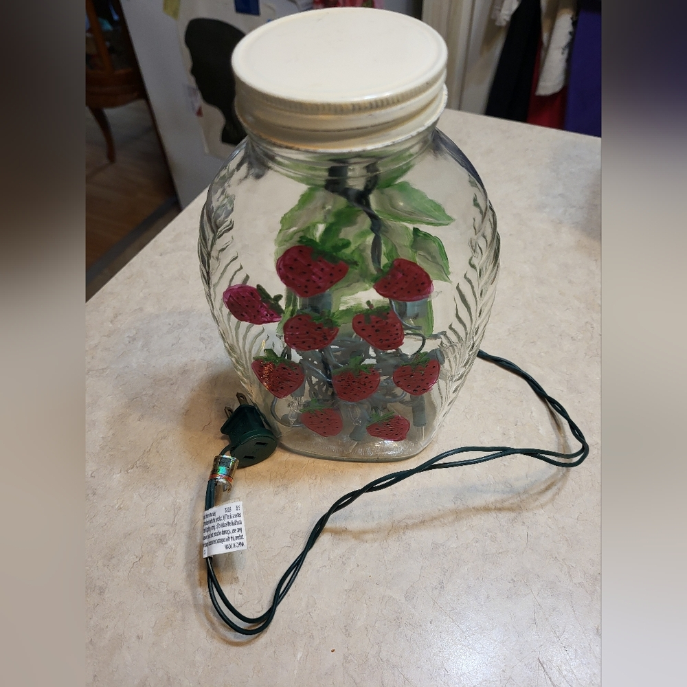 Glass Jar w/string of Lights and Painted Strawberries approx 9 inches high